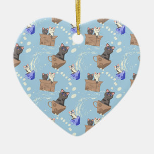 Cats in box and milk drops on blue ceramic ornament