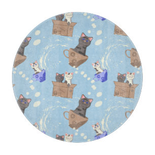 Cats in box and milk drops on blue cutting board