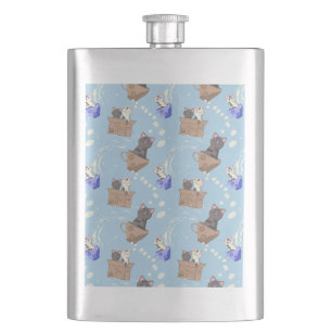 Cats in box and milk drops on blue flask