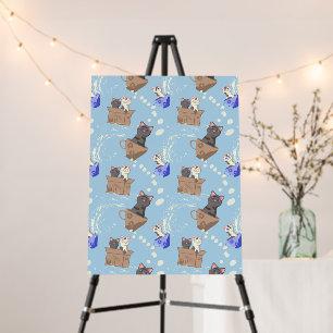 Cats in box and milk drops on blue foam board