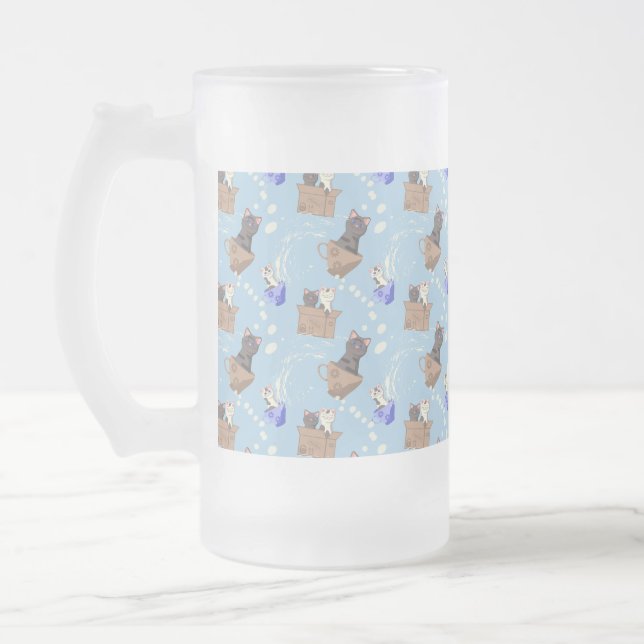 Cats in box and milk drops on blue frosted glass beer mug (Left)