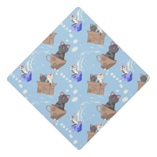 Cats in box and milk drops on blue graduation cap topper