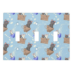 Cats in box and milk drops on blue light switch cover