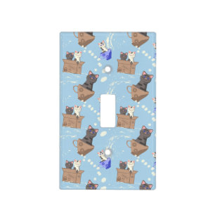 Cats in box and milk drops on blue light switch cover