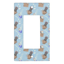 Cats in box and milk drops on blue light switch cover