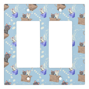 Cats in box and milk drops on blue light switch cover