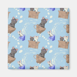 Cats in box and milk drops on blue magnet