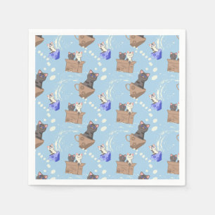 Cats in box and milk drops on blue napkins