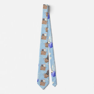 Cats in box and milk drops on blue neck tie