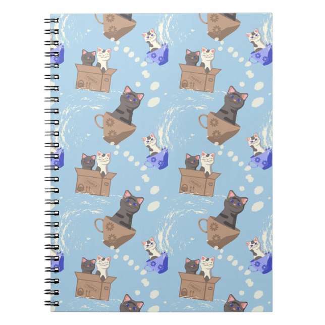 Cats in box and milk drops on blue notebook (Front)