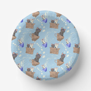 Cats in box and milk drops on blue paper bowls