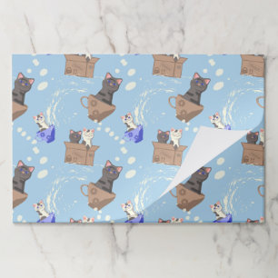 Cats in box and milk drops on blue paper pad