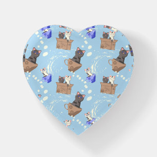 Cats in box and milk drops on blue paperweight
