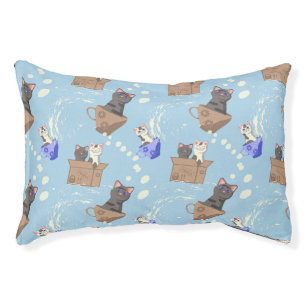 Cats in box and milk drops on blue pet bed
