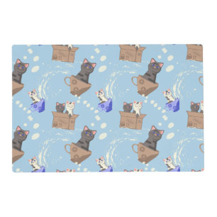 Cats in box and milk drops on blue placemat