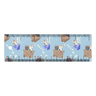 Cats in box and milk drops on blue ruler