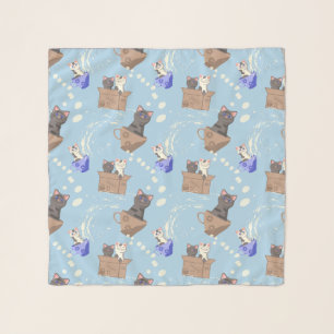 Cats in box and milk drops on blue scarf