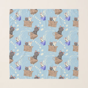 Cats in box and milk drops on blue scarf