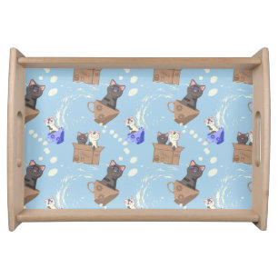 Cats in box and milk drops on blue serving tray