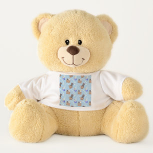 Cats in box and milk drops on blue teddy bear