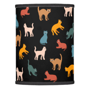Cats on the black lamp shade