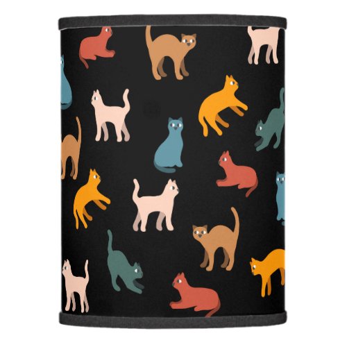 Cats on the black lamp shade