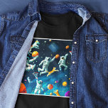 Cats Playing Basketball in Space with Astronauts T-Shirt<br><div class="desc">This cool computer-generated digital art graphic shows cats playing basketball in space with astronauts. Created with multiple image generations of the AI source DALL-E,  this futuristic artwork is fun for fans of technology,  space,  astronauts,  and cats!

Makes a great birthday,  Christmas,  or other holiday gift. 

#generativecontent</div>