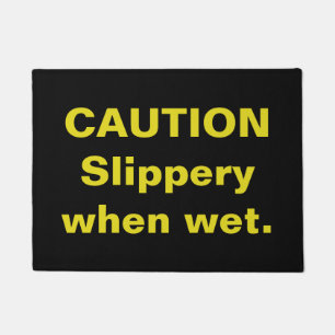 Caution. Slippery when wet. Doormat