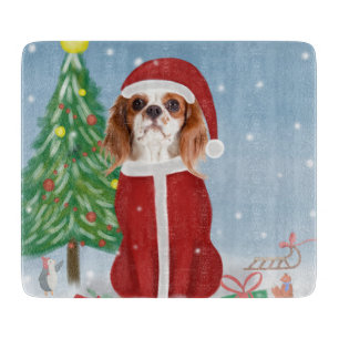 Cavalier King Dog in Snow with Christmas gifts Cutting Board