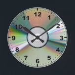"CD" design wall clocks<br><div class="desc">A fun and funky wall clock featuring fun and funky design. This would make the ideal gift for a friend, family member or a loved one. Heck, why not buy it for yourself. This design is available on both round, square and aqua style clocks all of which would look great...</div>