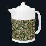 Celtic Bloom Teapot<br><div class="desc">Celtic Bloom feels like spring awakening in an ancient land where folklore still breathes. The intertwining Celtic knots suggest music that loops, weaves, and circles back on itself like a living tapestry of melody. Bright green tones evoke lively fiddle dances and warm sunlight filtering through mossy forests, while the golden...</div>