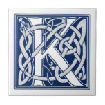 Celtic K Monogram Tile<br><div class="desc">A beautiful, decorative embossed celtic letter illuminated with gray dragon heads on a velvety dark blue background.</div>
