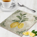 Ceramic Tile with Vintage Lemons<br><div class="desc">This exquisite ceramic tile, printed with the artist's signature, features beautifully ripe lemons, elegantly paired with a European-etched branch of full green leaves. The design showcases one whole lemon and a juicy lemon half on a neutral grey stone-textured background, capturing the rustic charm of nature. This piece is perfect for...</div>
