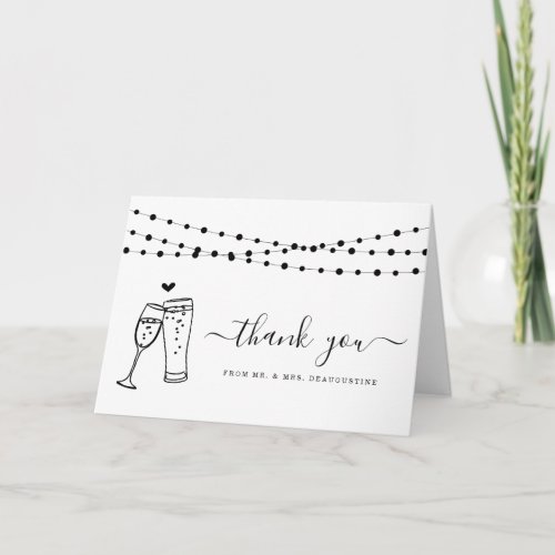 Champagne & Beer Toast & String Lights Thank You Card - Hand-drawn beer and champagne toast work on the front and room for your handwritten message inside.