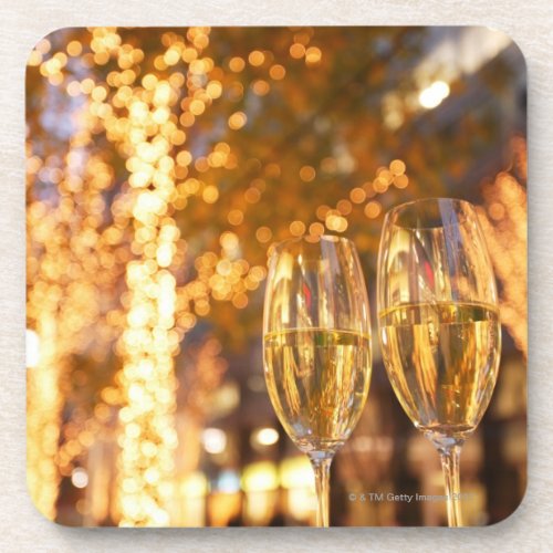 Champagne glasses toasting Christmas on city Beverage Coaster
