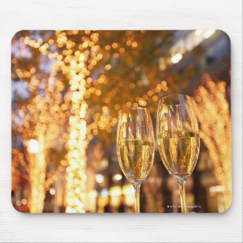 Champagne glasses toasting Christmas on city Mouse Pad