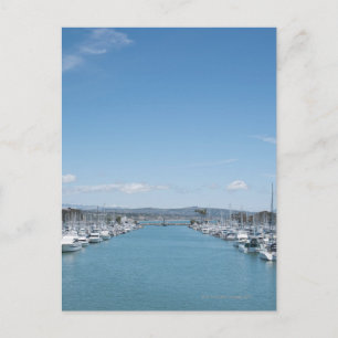 channel in harbor on a sunny day with blue sky postcard
