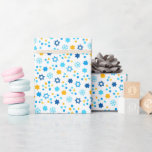 Chanukah Jewish Stars Snowflakes White Blue Gold Wrapping Paper<br><div class="desc">Add some holiday color and sparkle with this fun Chanukah wrapping paper design. Appropriate for children or adults, corporate or family gift wrap needs. There are coordinating gift bags, tissue paper, and ribbon for a complete Chanukah look, or you can mix and match with our other Chanukah wrapping paper patterns....</div>
