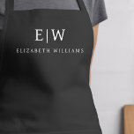 Charcoal Grey Modern Minimalist Monogram Name Apron<br><div class="desc">Elevate your culinary experience with our Classic Elegant Modern Minimalist Monogram Name Cooking Apron. This kitchen essential seamlessly merges timeless elegance with contemporary minimalism. Crafted with precision, this apron is not just a practical accessory but also a statement of personal style. The customizable monogram and name option allows you to...</div>