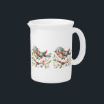 Charming Patchwork Folk Art Bird Floral Accents Beverage Pitcher<br><div class="desc">This delightful patchwork bird design brings a cozy folk-art charm to any space, featuring a beautifully stitched quilted pattern in warm, nostalgic hues. The intricate mix of floral, gingham, and stitched textures evokes the comforting feel of a handmade vintage quilt, making it a perfect addition for those who adore the...</div>