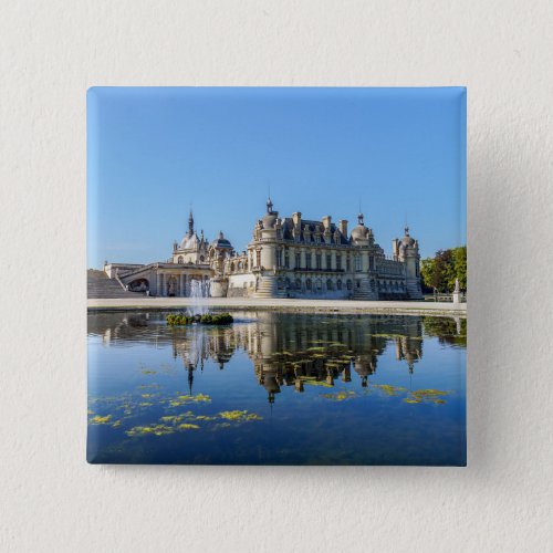 Chateau de Chantilly with reflection in a pond Button