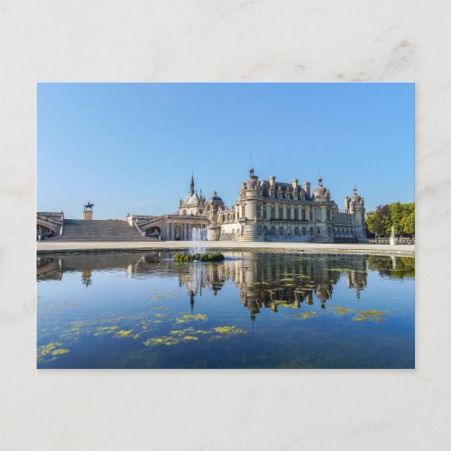 Chateau de Chantilly with reflection in a pond Postcard