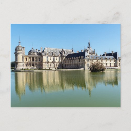 Chateau de Chantilly with reflection in the lake Postcard