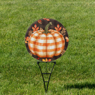 Checked pumpkin and falling leaves round yard sign
