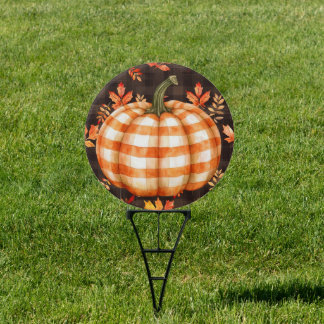 Checked pumpkin and falling leaves round yard sign
