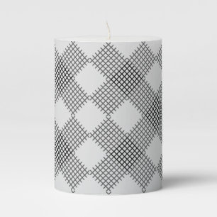 Checkered patches pattern black and white pillar candle