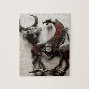 Cheek piece of a horse bit in the form of a human- jigsaw puzzle