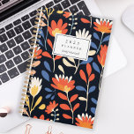 Cheerful Orange Floral Pattern Personalized 2025 Planner<br><div class="desc">Personalize this planner with your name in black italics framed by a white rectangle,  on a bold,  cheerful pattern of orange and white flowers on a black background.</div>