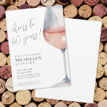 Cheers To 60 Years 60th Birthday Party Invitation<br><div class="desc">"Cheers to 60 years!" is proudly displayed at the top of this classic and elegant invitation, featuring a large watercolor pink and gray wine glass on the right side, giving it a modern twist. You can customize the year to celebrate any milestone. The design uses script typography for "Cheers to...</div>