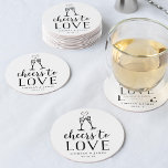Cheers to Love Wedding Round Paper Coaster<br><div class="desc">Make your wedding cocktail hour even more memorable with these sweetly romantic paper coasters, featuring a pair of champagne flutes joined by an effervescent heart, with "cheers to love" and your names and wedding date beneath. Chic black and white typography design makes an elegant yet lighthearted addition to your wedding...</div>